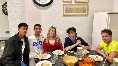 Sam and other students eating at Rosales residence hall.