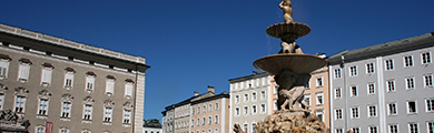 Image of buildings and a fountain in Austria