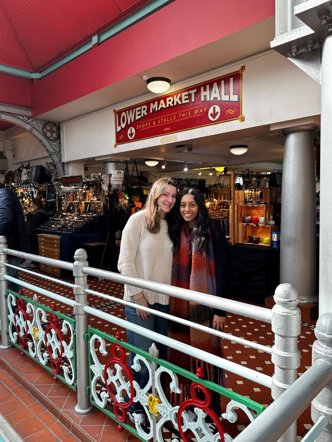 Carina and another student standing in front of a storefront in London.