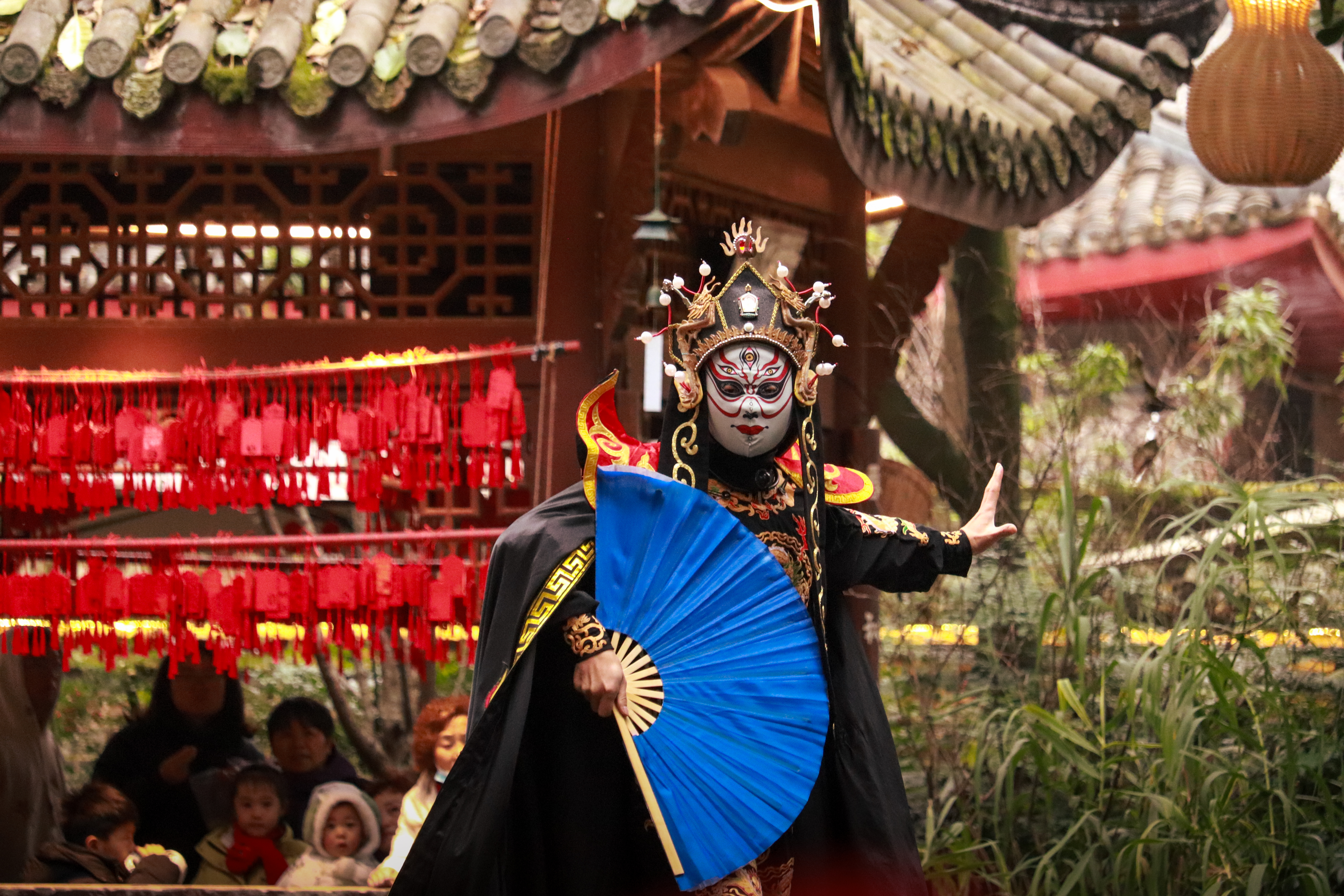A face-changing Sichuan Opera performer in Chengdu’s People’s Park in Chengdu, China. 
