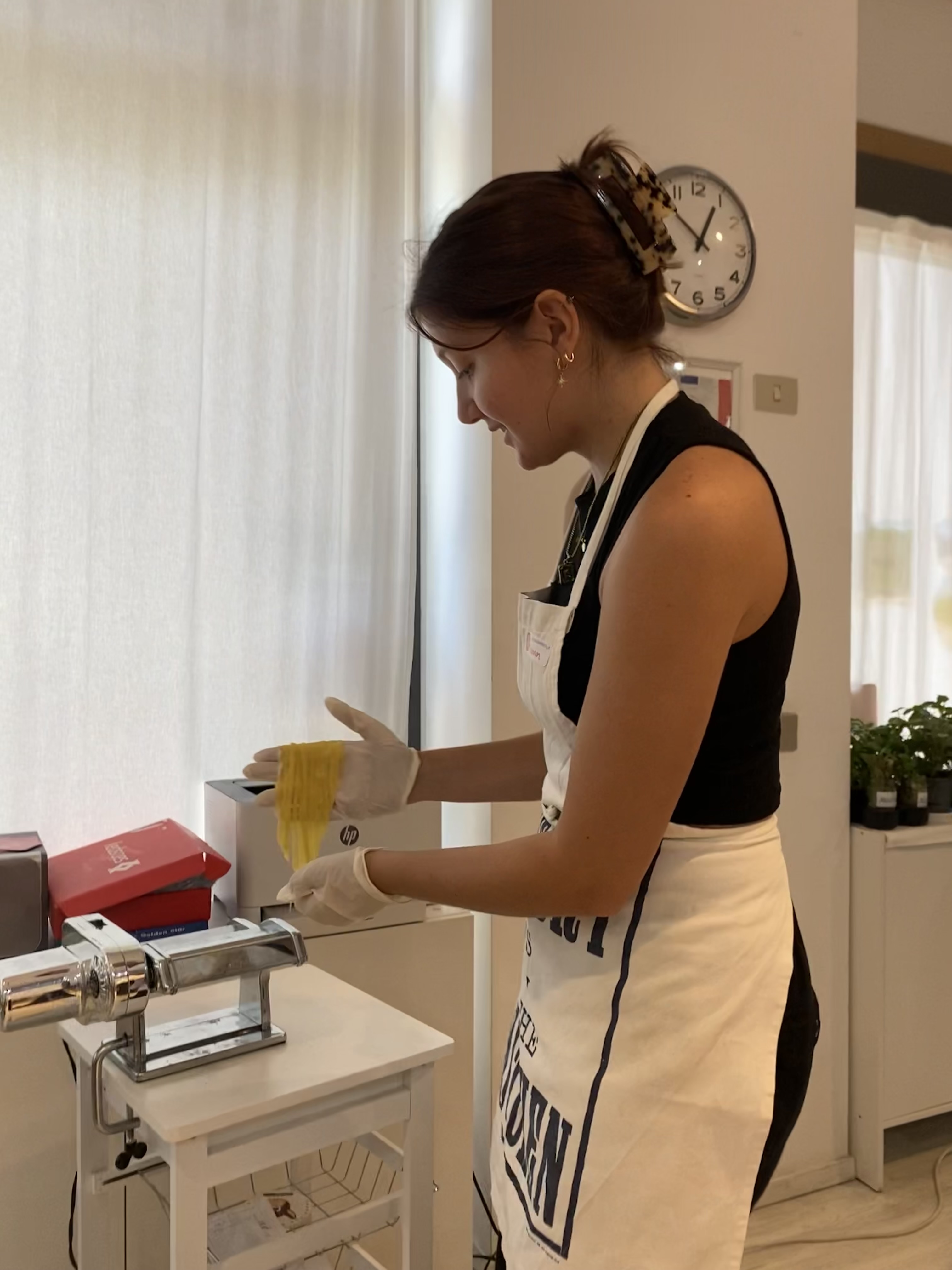 Image of Shannon using a pasta machine